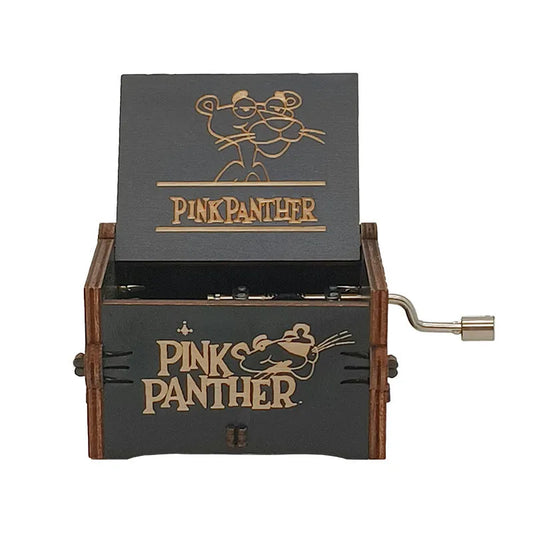 Wooden music box with 'Pink Panther' branding on a white background