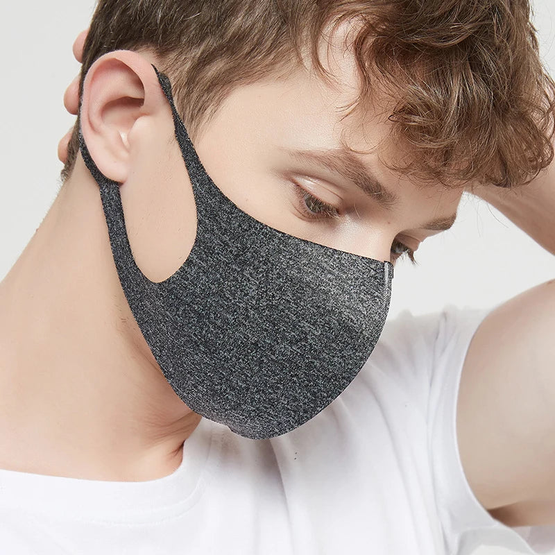 Side view of a grey melange ice silk face mask with wide ear loop