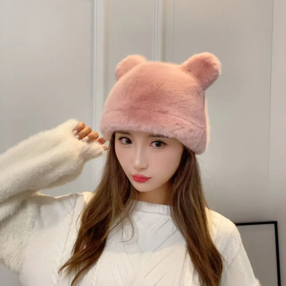 Woman wearing a pink fluffy bear ear hat