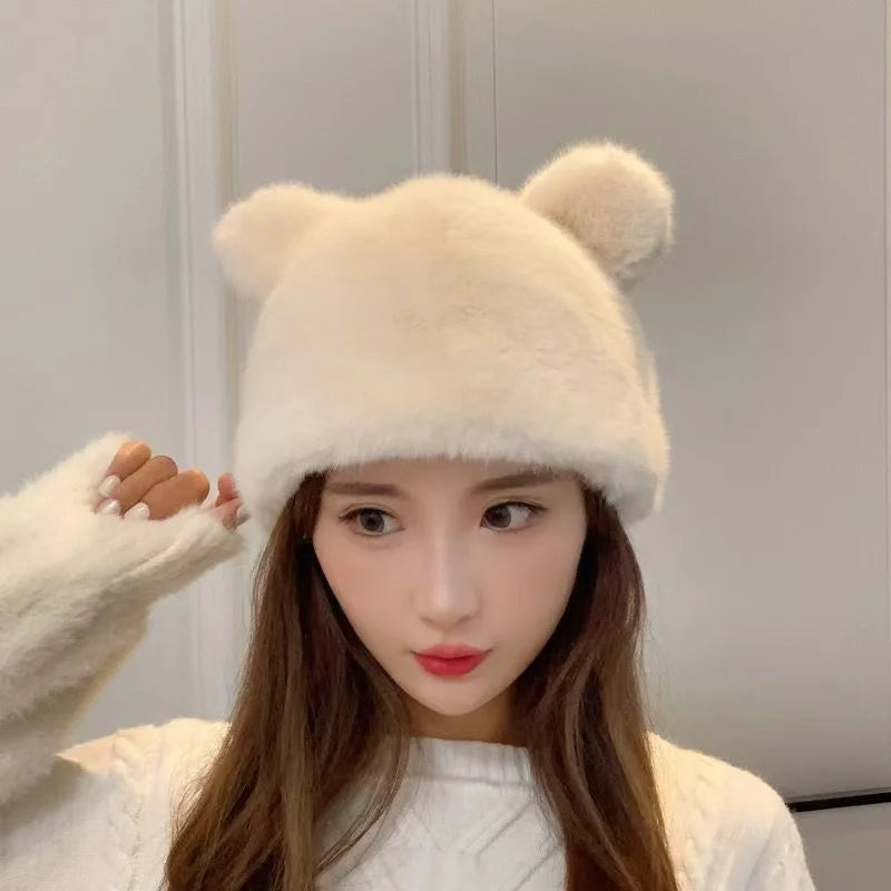 Woman wearing a white fluffy bear ear hat