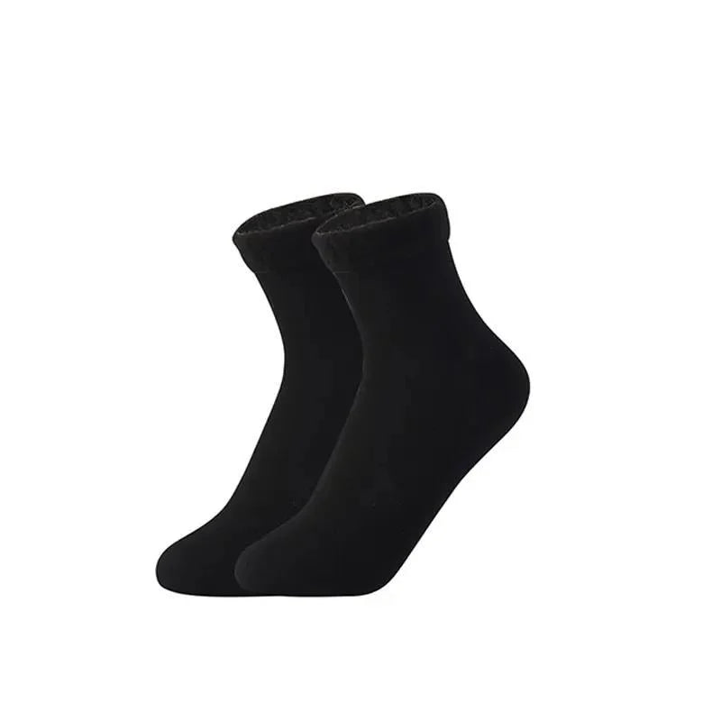 Pair of black velvet thermal socks with fleece-lined cuffs on a white background