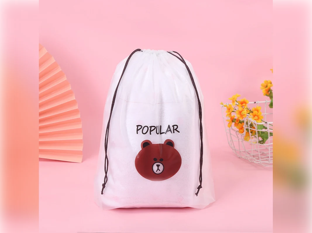 Clear drawstring storage bag with a bear print