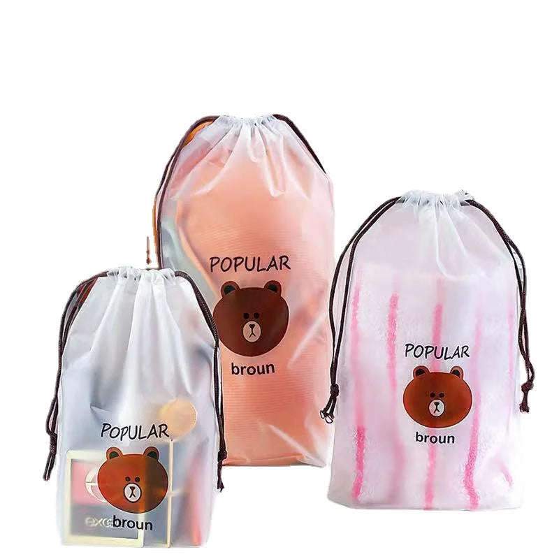 Bear design drawstring storage bags filled with towels, makeup and accessories