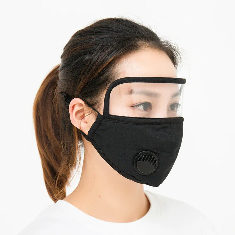 Black face mask with clear eye shield and breathing valve, side view