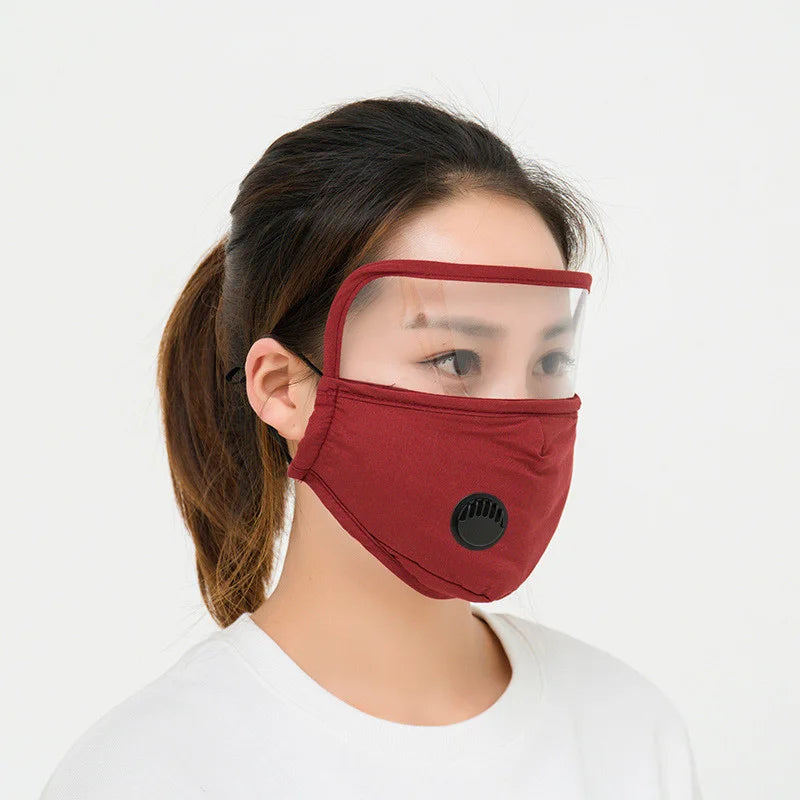 Red face mask with clear eye shield and breathing valve, side view