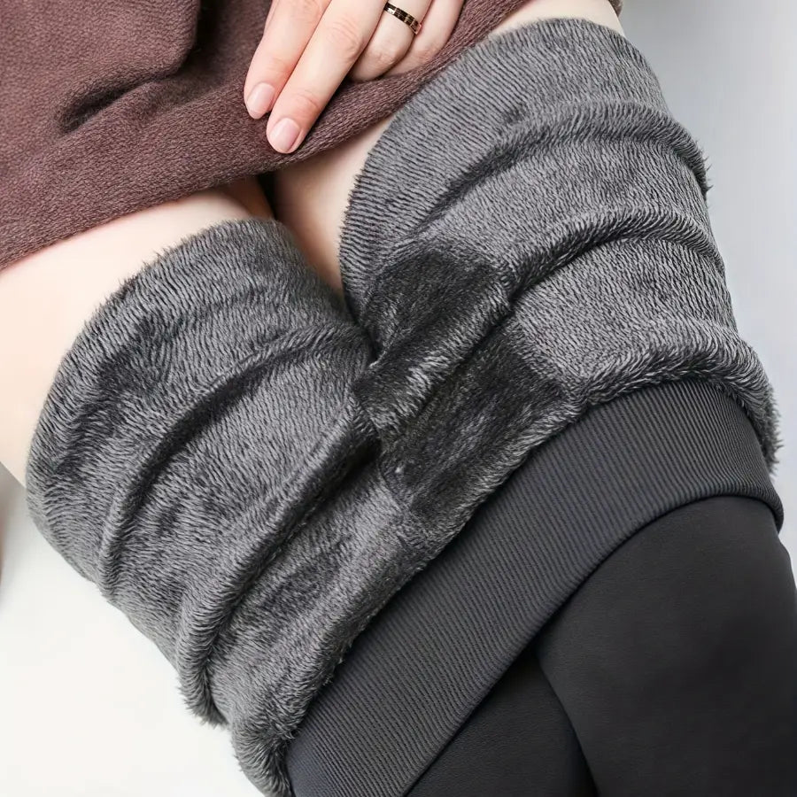 Dark grey fleece-lined leggings rolled down to show the dense plush fleece lining