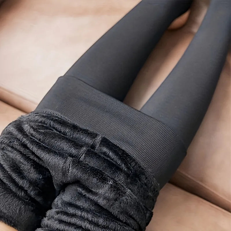 Black tights rolled down to show the black fleece lining