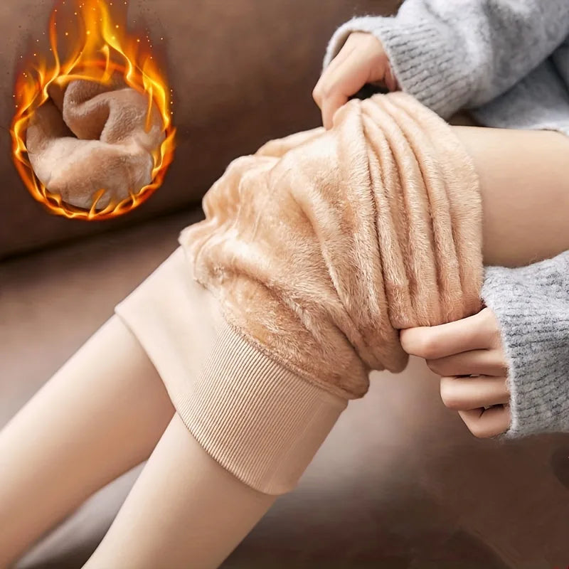Skin colour tights rolled down at the thigh to show the thick fleece lining
