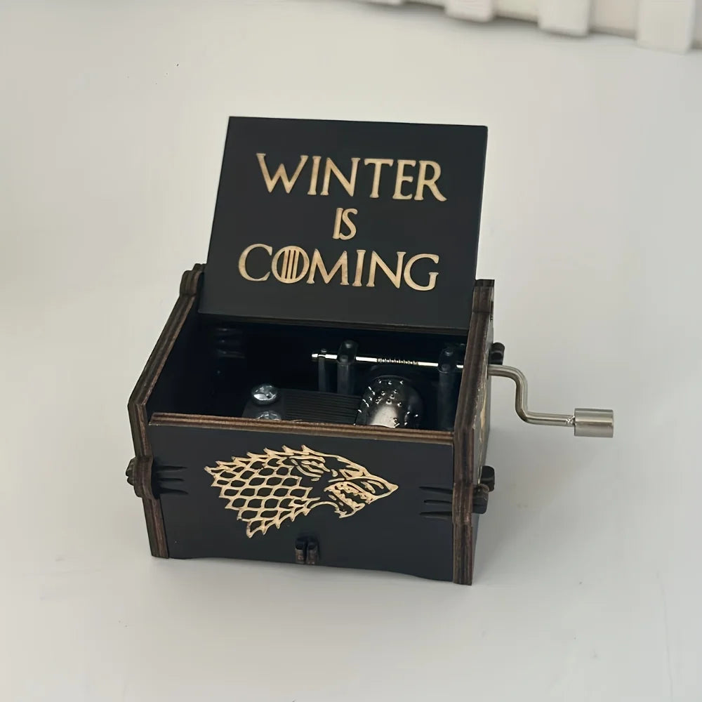 Black wooden hand-crank music box engraved with Winter Is Coming and a wolf design