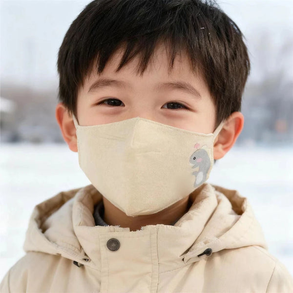 Kids cotton face mask in beige with a grey dino print