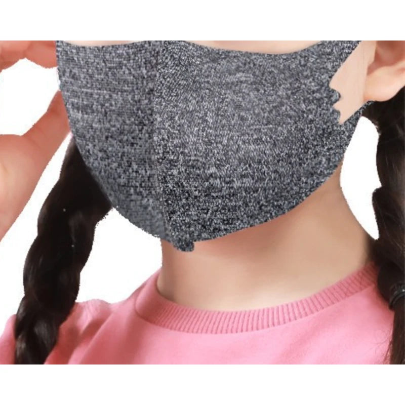 Child wearing a grey kids cotton ice silk face mask