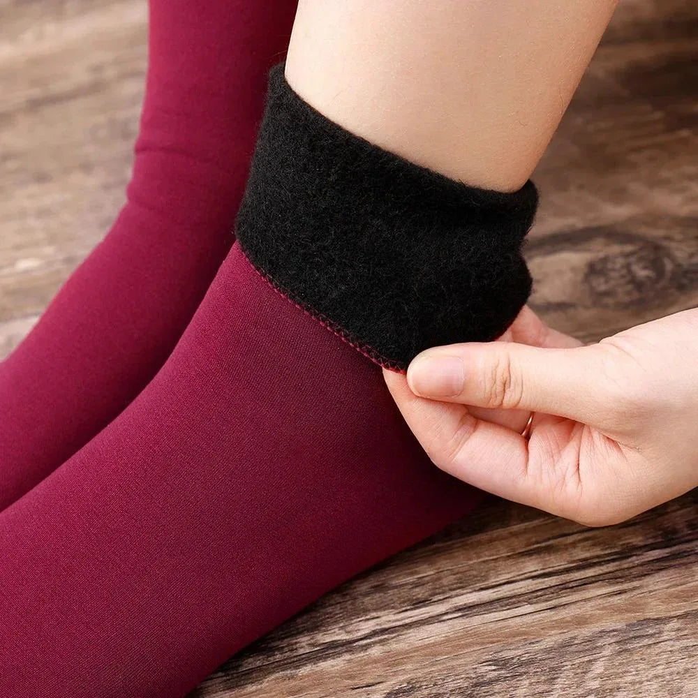 Maroon velvet thermal socks worn with the black fleece cuff folded down