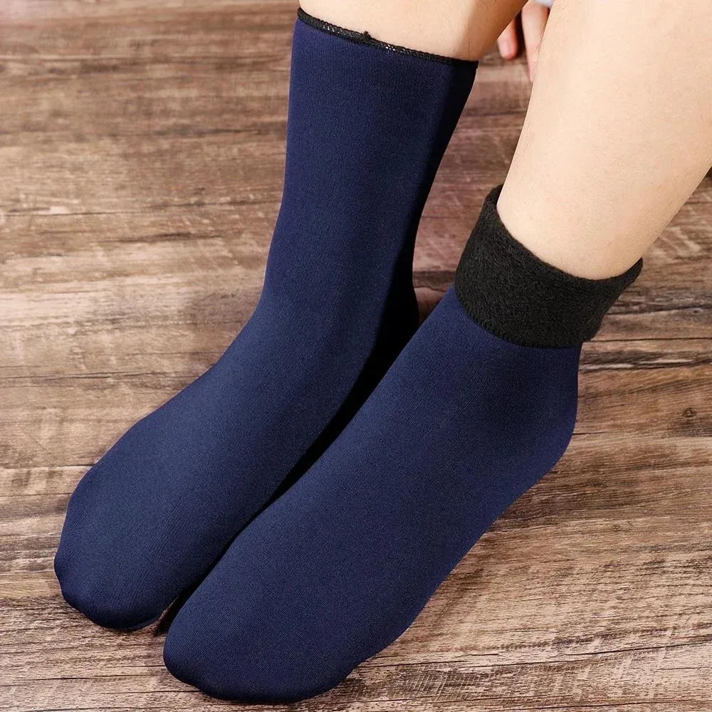 Navy blue velvet thermal socks worn, one cuff folded down to show the fleece lining