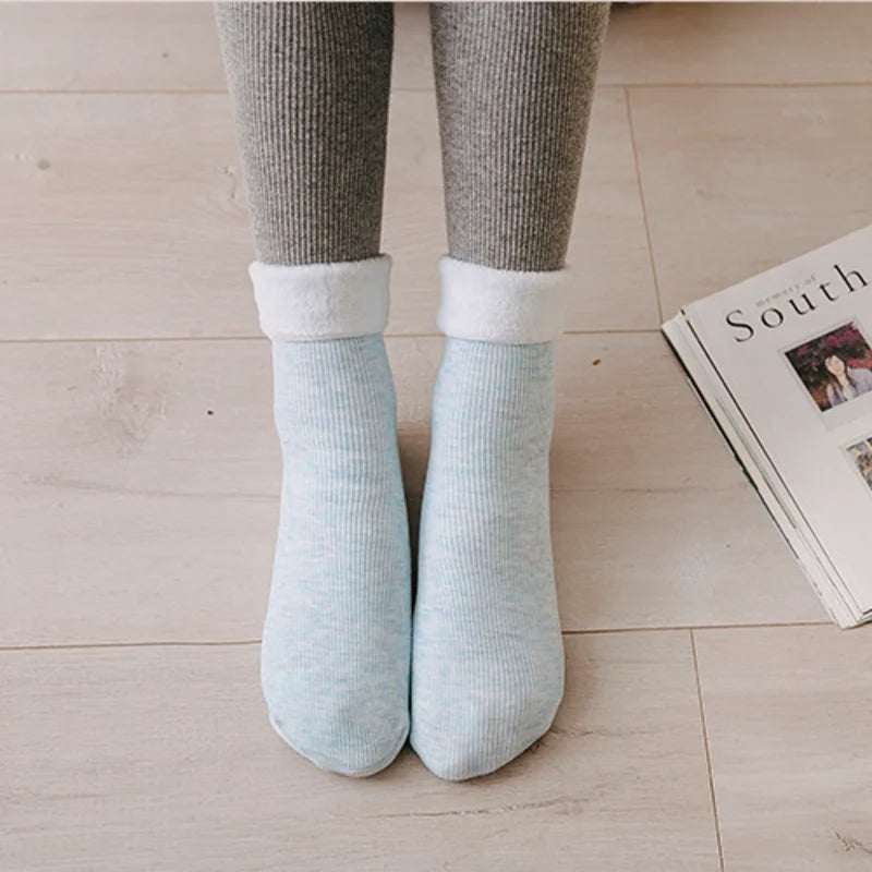 Light blue premium fleece-lined socks worn with grey leggings