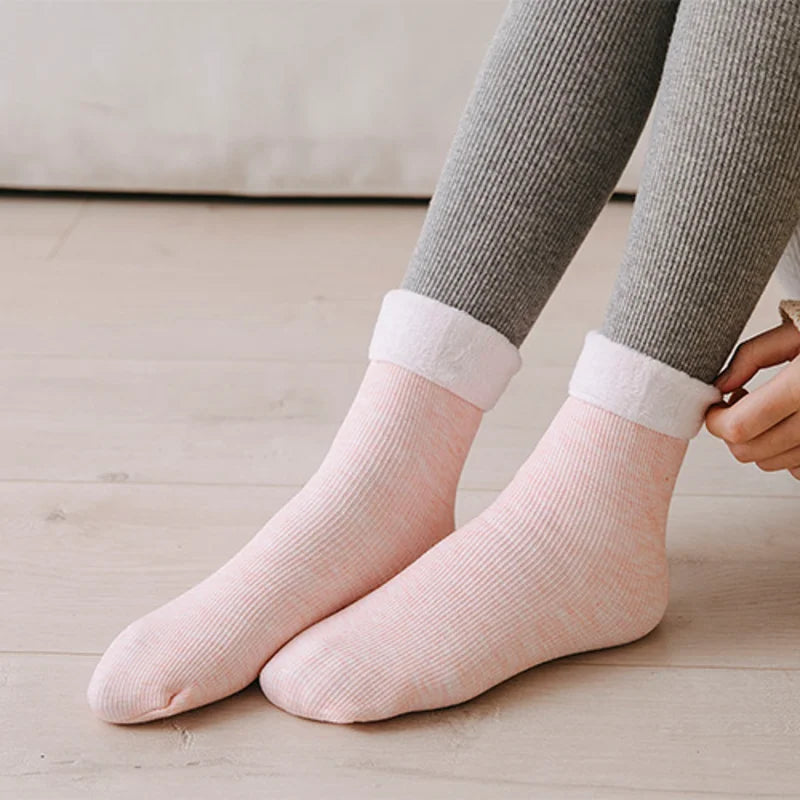 Pink premium fleece-lined socks worn with grey leggings