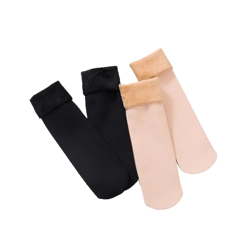 One pair of black and one pair of skin colour velvet fleece-lined thermal socks laid flat