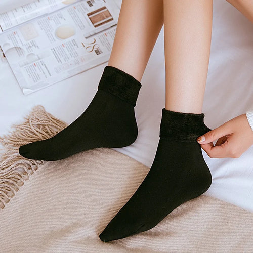 Black velvet fleece-lined thermal socks worn with the plush cuff folded down