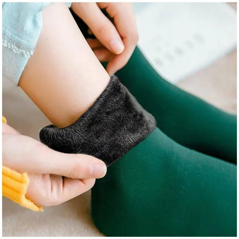 Green velvet thermal sock with the cuff folded down to show the plush fleece lining
