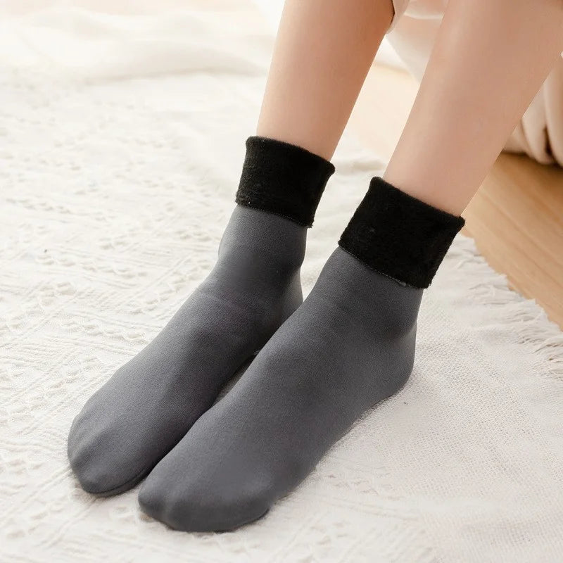 Grey velvet fleece-lined thermal socks worn with black fleece cuffs