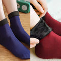 Couple's pack of blue and maroon velvet fleece-lined thermal socks