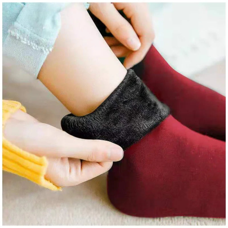 Maroon velvet thermal sock with the cuff folded down to show the plush fleece lining