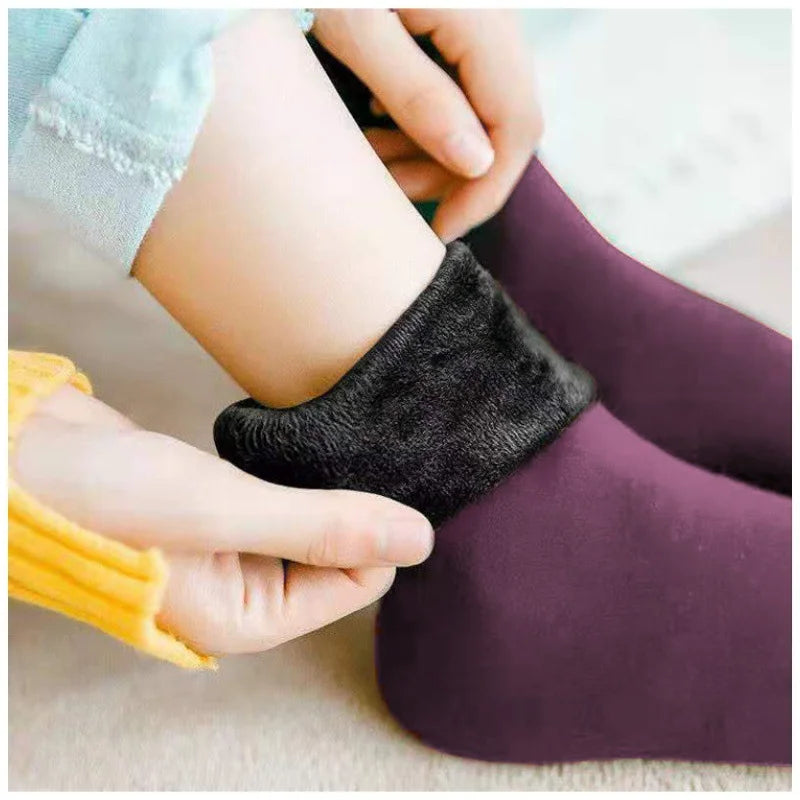 Plum velvet thermal sock with the cuff folded down to show the plush fleece lining