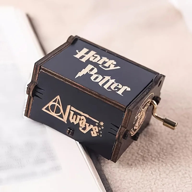 Closed black wooden wizard music box with engraved lid and Always on the front