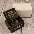 Always wooden music box open to show the metal mechanism, with its white gift box behind